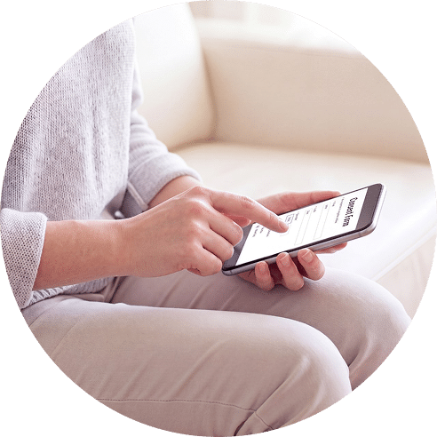 Parent completing an online HIPAAtizer pediatric consent form on smartphone from home.